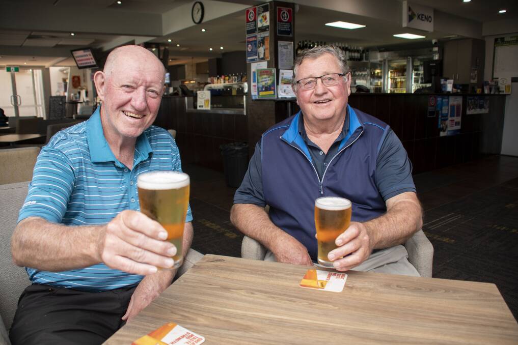 Golfing mates Ray Mills and Grahame Marchant in one of their regular socials at the Dubbo Golf Club clubhouse. Picture: Belinda Soole