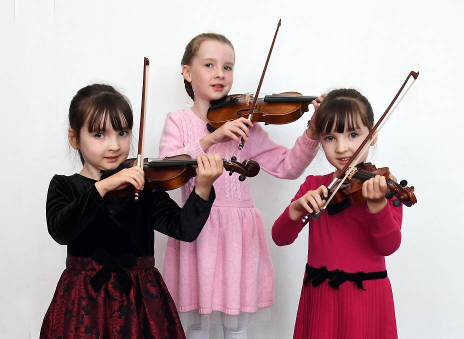 MUSIC STARS: Budding violinists Skye, Larissa and Caitlin Elder performed at the Dubbo Eisteddfod on Monday. Photo: BELINDA SOOLE