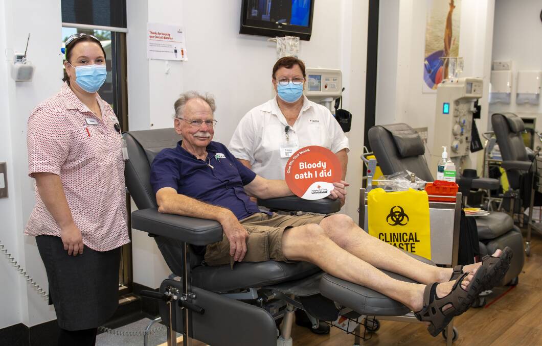 Saving lives: Blood and plasma donor Ken Wallwork (centre) at the Dubbo centre to make his 370th donation, with Lifeblood registered nurse Stacie Wilkinson and Lifeblood Dubbo session leader Sharon Parker. Picture: BELINDA SOOLE