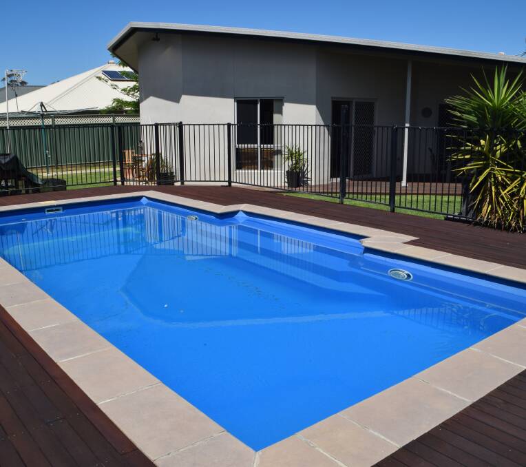 Perfect area: The alfresco space with timber decking complements the barbecue area and in-ground pool.