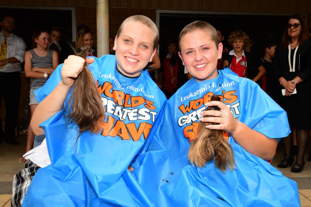 Chop: Dubbo's Emily Hollier and Chloe Carey shaved their heads to raise funds for the Leukaemia Foundation last year.
Photo: BELINDA SOOLE 