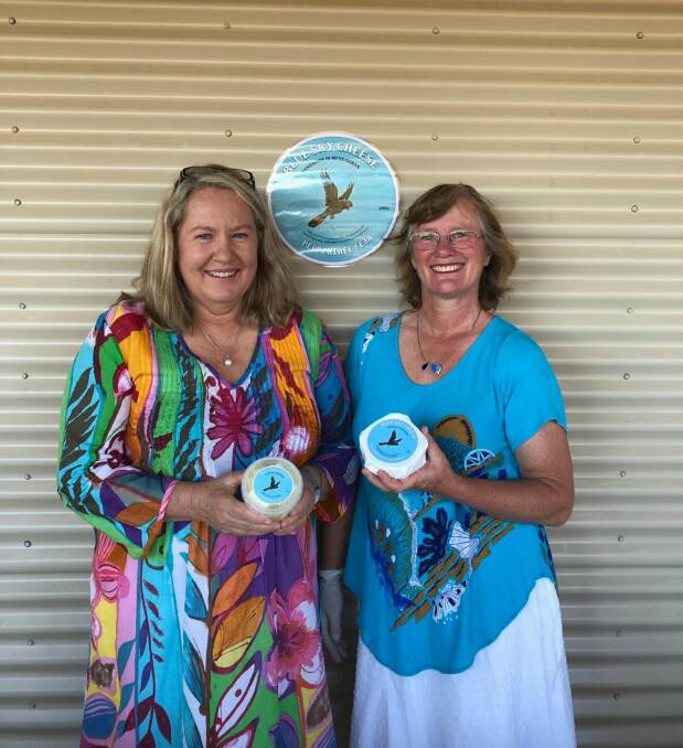 Cheese makers: Pip Archer and Deb Kiem display their two Blue Sky Cheeses, Peppertree Feta and Castlereagh Camembert.  Photo: Supplied. 