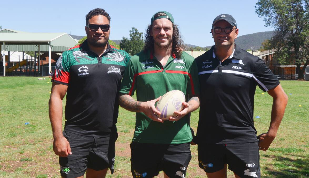 HELPING OUT: South Sydney Rabbitohs second-rower Ethan Lowe (middle) with Yileen 'Buddy' Gordon and John Sutton at Wellington Public School for the Souths Care program. Photo: TAYLOR JURD