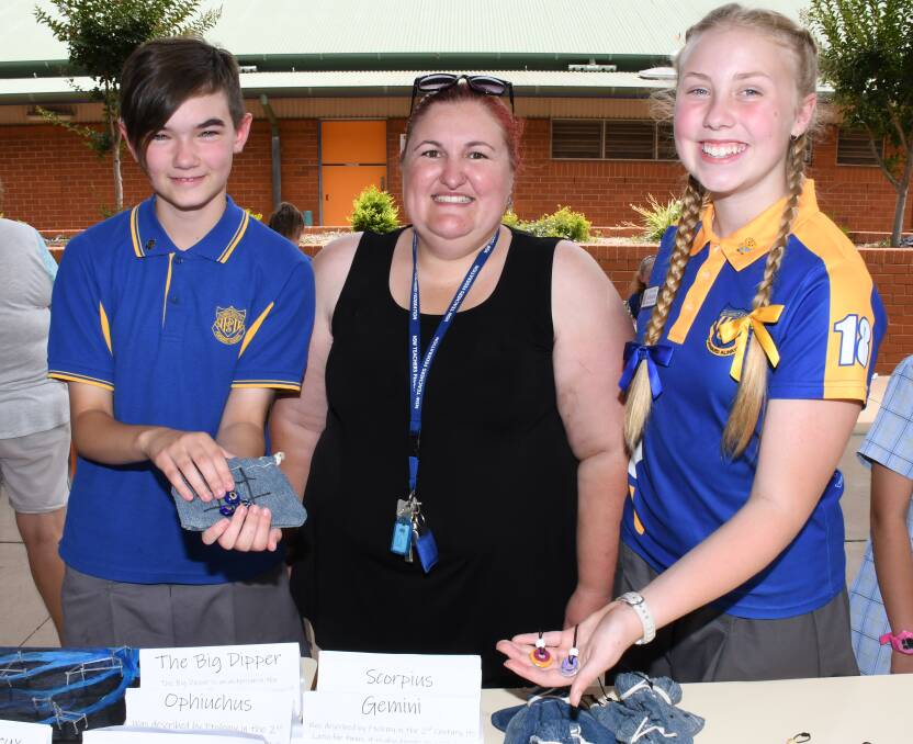 Drought fair: Dubbo South Public students Freya Stein and Mali Hopkins-Davies with  Sally Constable. Photo: Belinda Soole. 