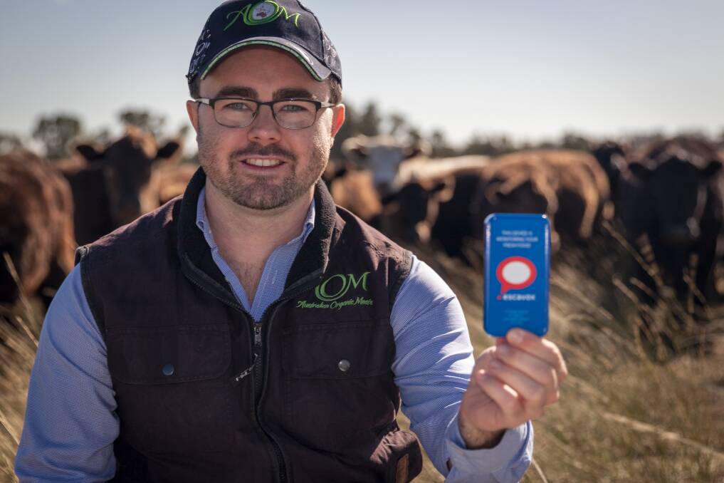 Sam O'Leary, from Australian Organic Meats, with the Escavox data tracker system. Photo: Supplied. 
