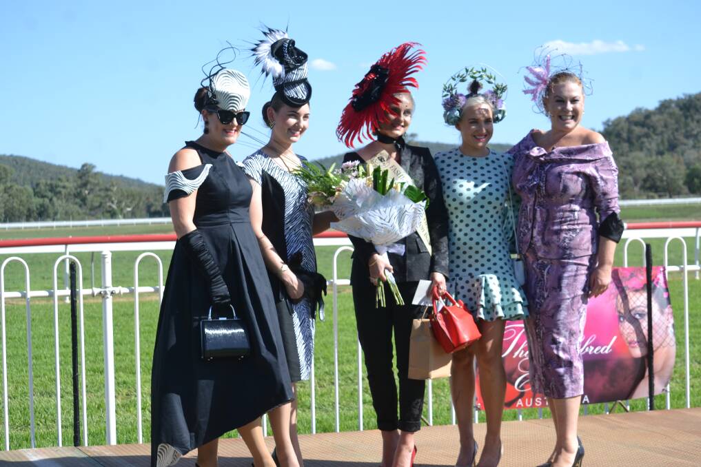 The 2019 Wellington Boot Fashions on the Field winner Josie Anderson (Centre) surrounded by runners up and host Sharon Lenton (right). Photo: Daniel Shirkie. 