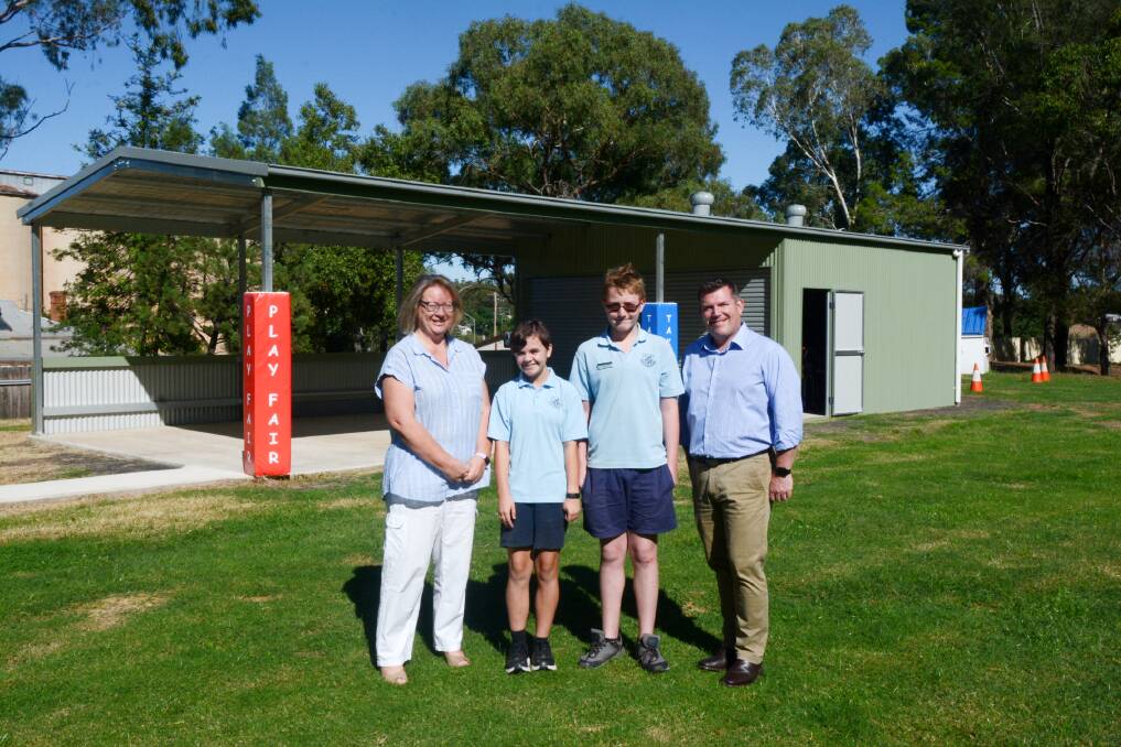 Project complete: Geurie Public School principal Trish Farley with students Jasmine and Bradley and Dubbo MP Dugald Saunders in front of the sheltered, play space. Photo: Taylor Jurd