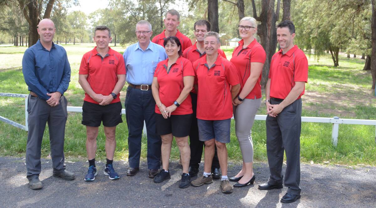 Water, water everywhere: DRC's Ben Pilon, with members of the Mud Run committee and Member for Parkes Mark Coulton. Photo: Taylor Jurd.
