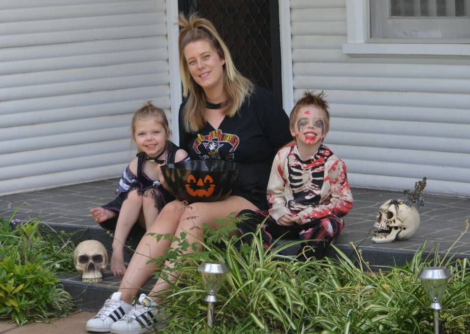 Spooky: Tara Rymer with three-year-old, Izzy (a skeleton) and five-year-old Asher (a zombie).  Photo: Taylor Jurd.