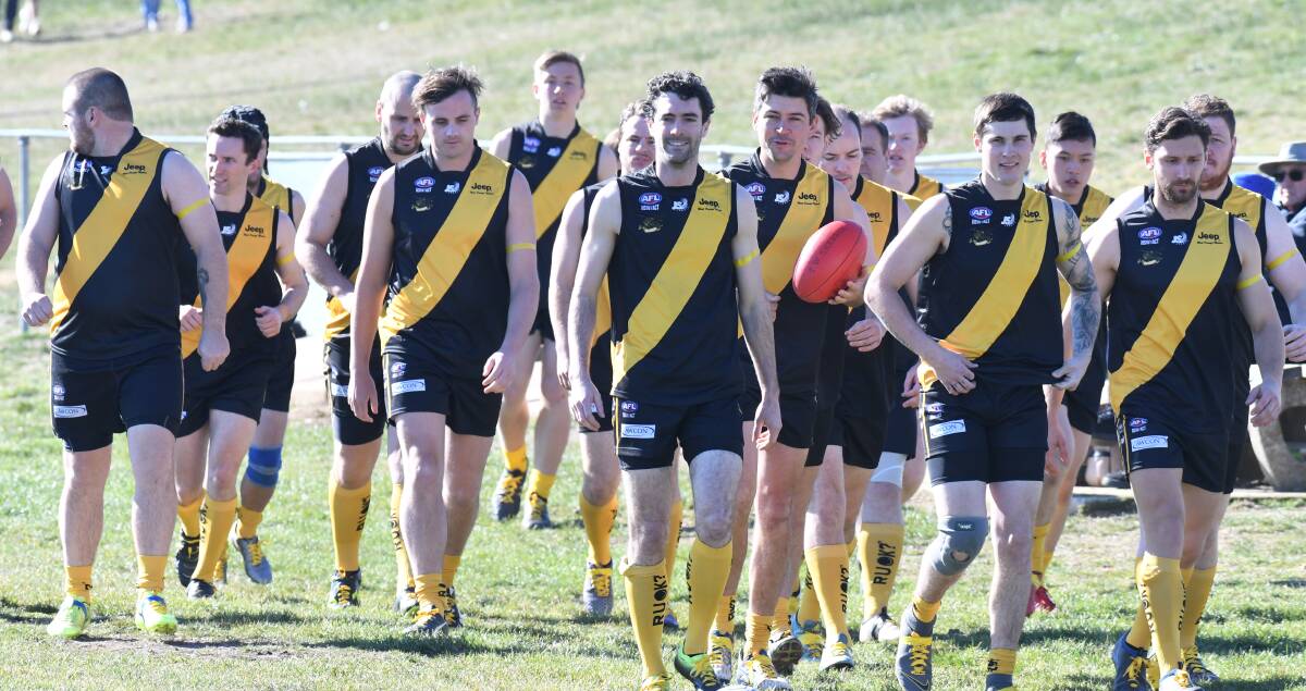 R U OK: The Tigers, led by co-captain Mick Evans, sporting the R U OK socks and shoelaces. Photo: CARLA FREEDMAN. 
