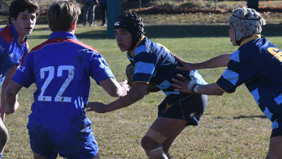 IN TRAFFIC: Douglas Philipson looks to get away in Central West's game against Manly at Orange on Sunday. Photo: CARLA FREEMAN