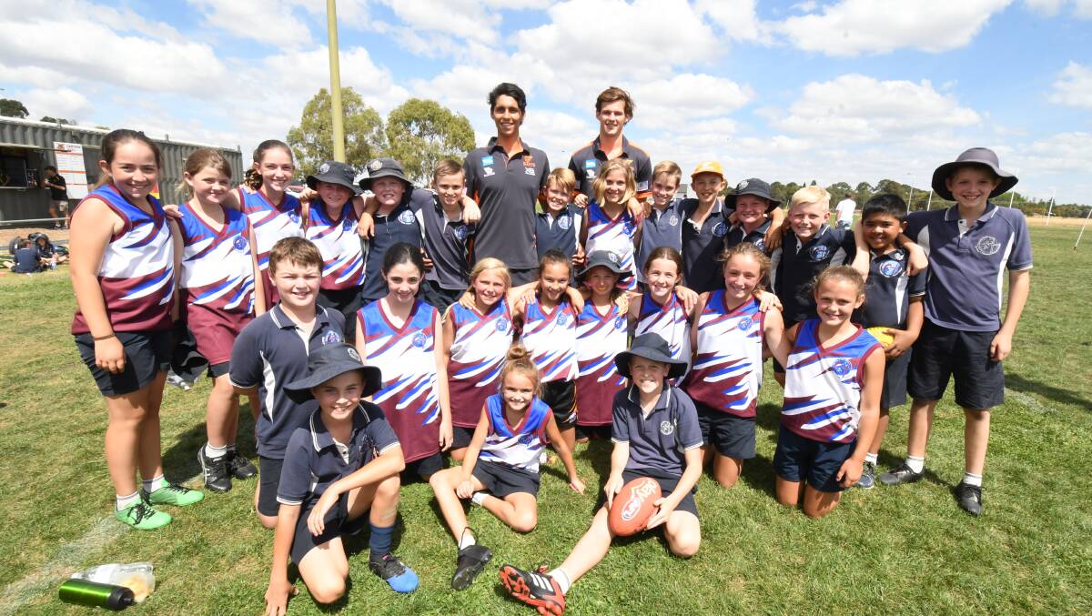 St Mary's students with Giants players Nick Shipley and Jack Buckley. Photo: JUDE KEOGH