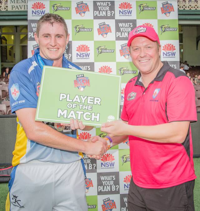 ACT Aces' Matthew Condon being presented with his Player of the Match award by Central Coast Cricket Manager David Winiata.