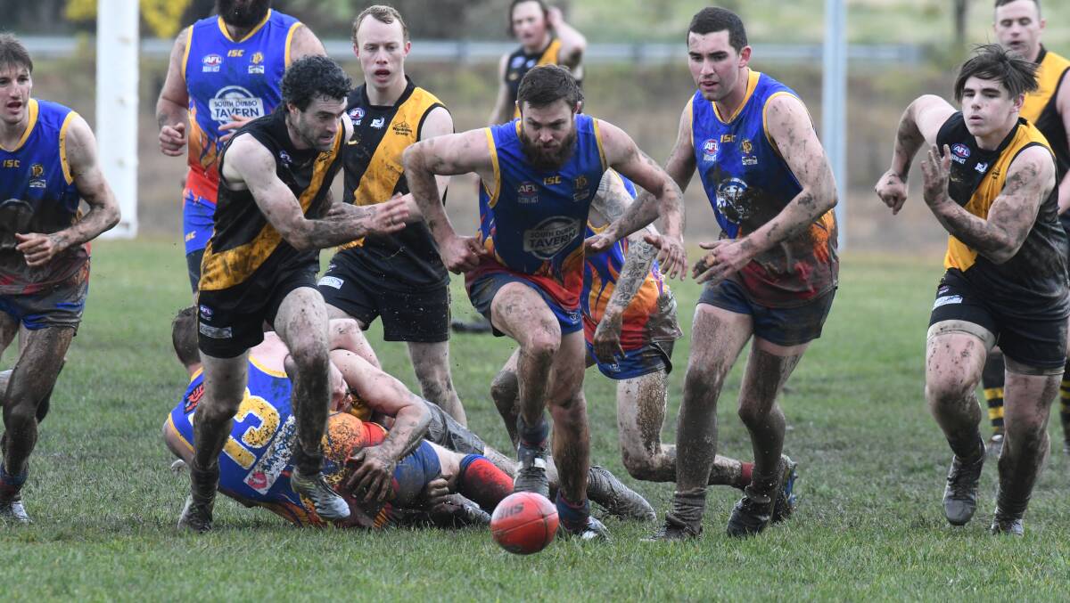 All the action from the mudbath at Waratahs between Orange Tigers and Dubbo Demons on Saturday. Photos: JUDE KEOGH