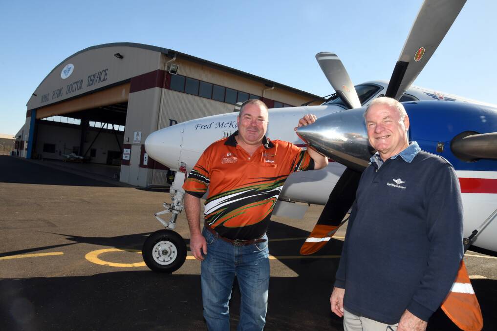 MATES: Brian Worboys and Terry Clark catch up at the Royal Flying Doctor Service Dubbo Base. Photo: BELINDA SOOLE