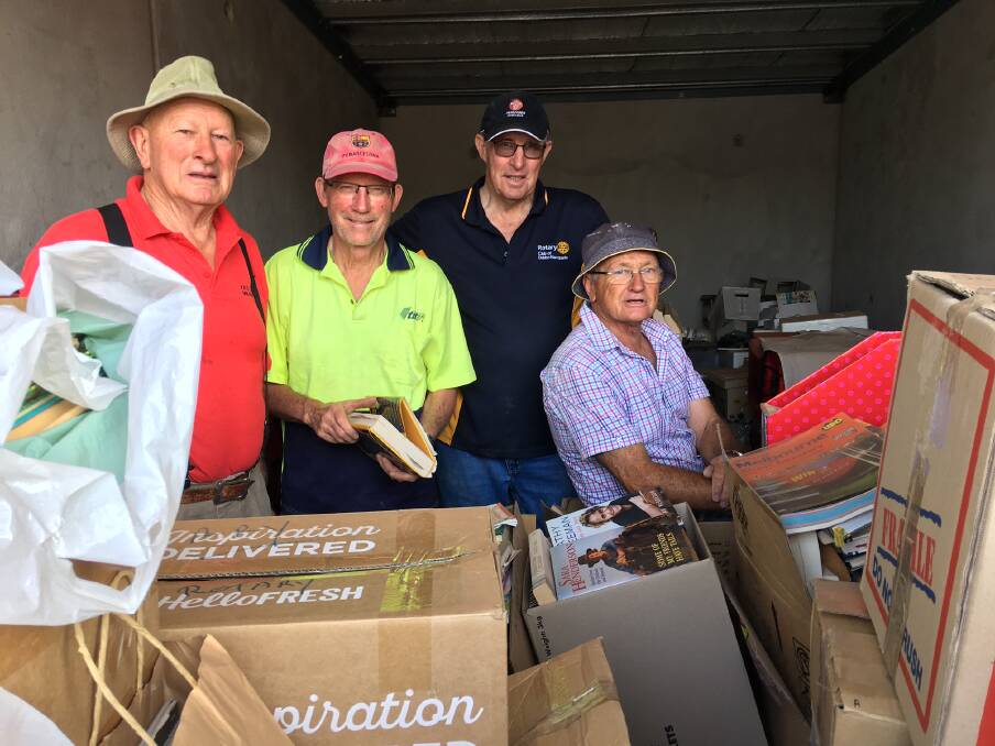 WORKING BEE: Allan Clarke, Garry Brown, Lawrie Donoghue and Kevin Parker help out at a 2019 Michael Egan Memorial Book Fair working bee. Photo: CONTRIBUTED.