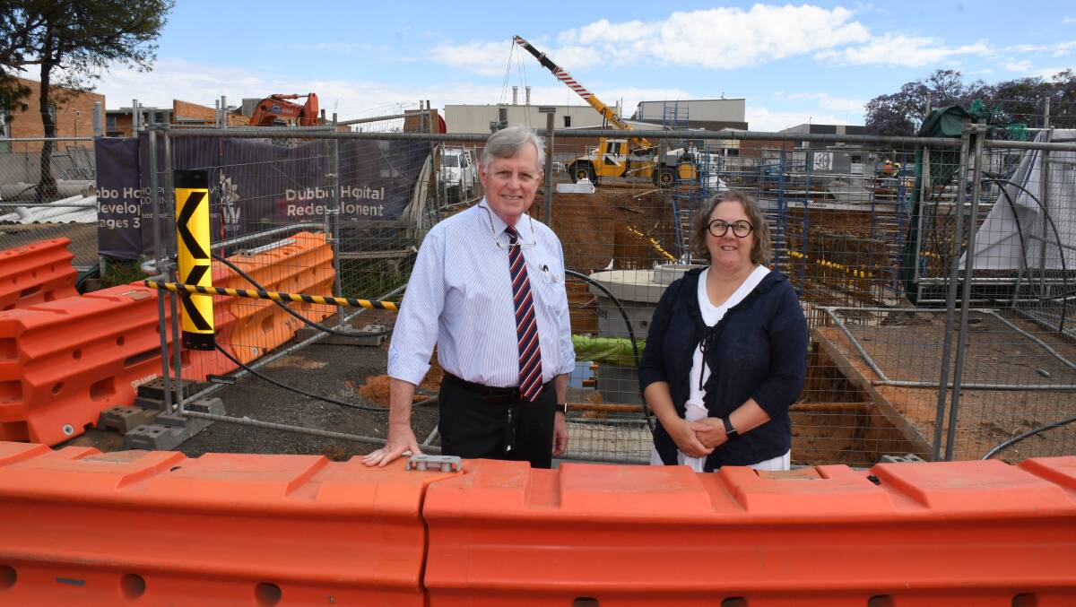 STAGE FOUR: Dubbo Hospital director of medical services Dr Geoff Hardacre and general manager Debbie Bickerton check out stage four redevelopment works including a storm water basin behind them. Photo: BELINDA SOOLE