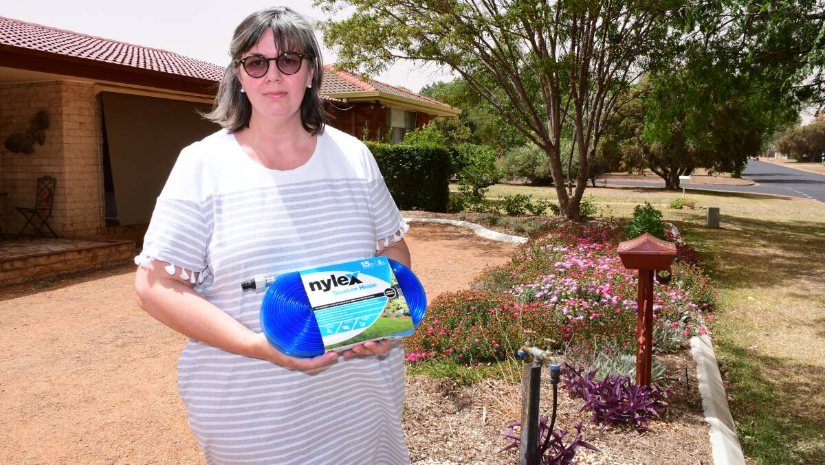 SOAKER HOSE: Felicite Wardman tells of a microspray watering system using far less water than soaker hoses currently in use across Dubbo. Photo: AMY MCINTYRE