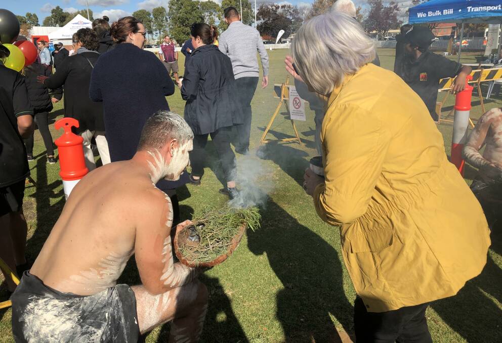 A smoking ceremony was embraced by the public at the National Sorry Day event at Dubbo. Photo: KIM BARTLEY
