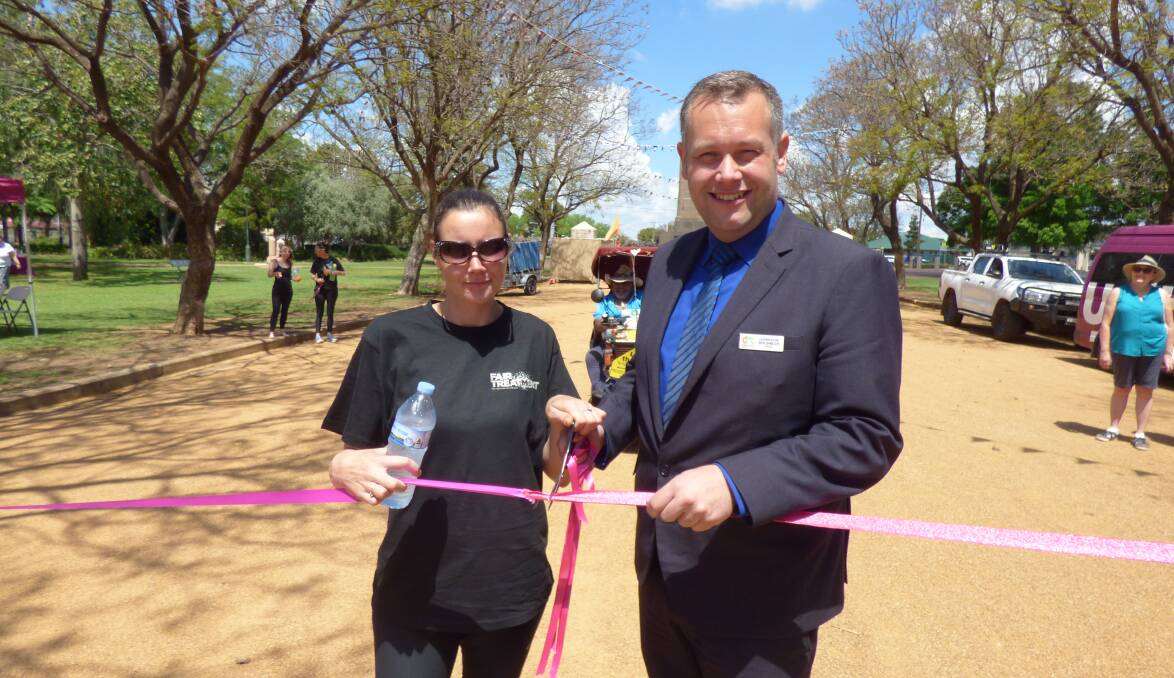 ONE STEP AT A TIME: Shantell Irwin and Dubbo mayor Ben Shields cut the ribbon to start the Long Walk to Treatment that will end in Sydney. Photo: KIM BARTLEY