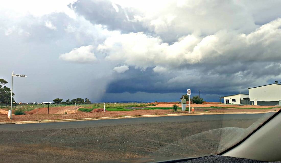 FEBRUARY RAIN: Rain clouds roll towards Dubbo City Regional Airport. Photo: JASON FERRARI