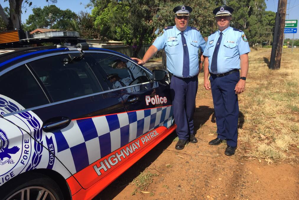 ROAD TRIP: Assistant Commissioner Michael Corboy and Assistant Commissioner Geoff McKechnie join forces to save lives on country roads. Photo: KIM BARTLEY