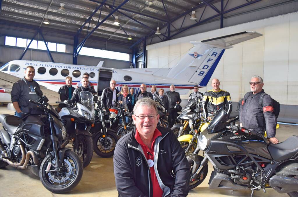 BRIGHT SMILES: Bill Patrick (front) and other participants in the 2017 Bright Smiles Charity Ride visit the Royal Flying Doctor Service South Eastern Section Base at Dubbo. Photo: Contributed