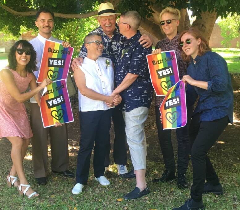 FIRST ANNIVERSARY: Kris Stevens and Bizzi Mason, being congratulated by family and friends after their January 15 2018 marriage, have celebrated their first anniversary. Photo: CONTRIBUTED
