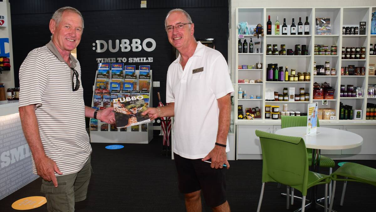 VOLUNTEER: Sydneysider Peter Bull learns about Dubbo from Bill Donnison, a volunteer at Dubbo Visitor Information Centre. Photo: AMY MCINTYRE.