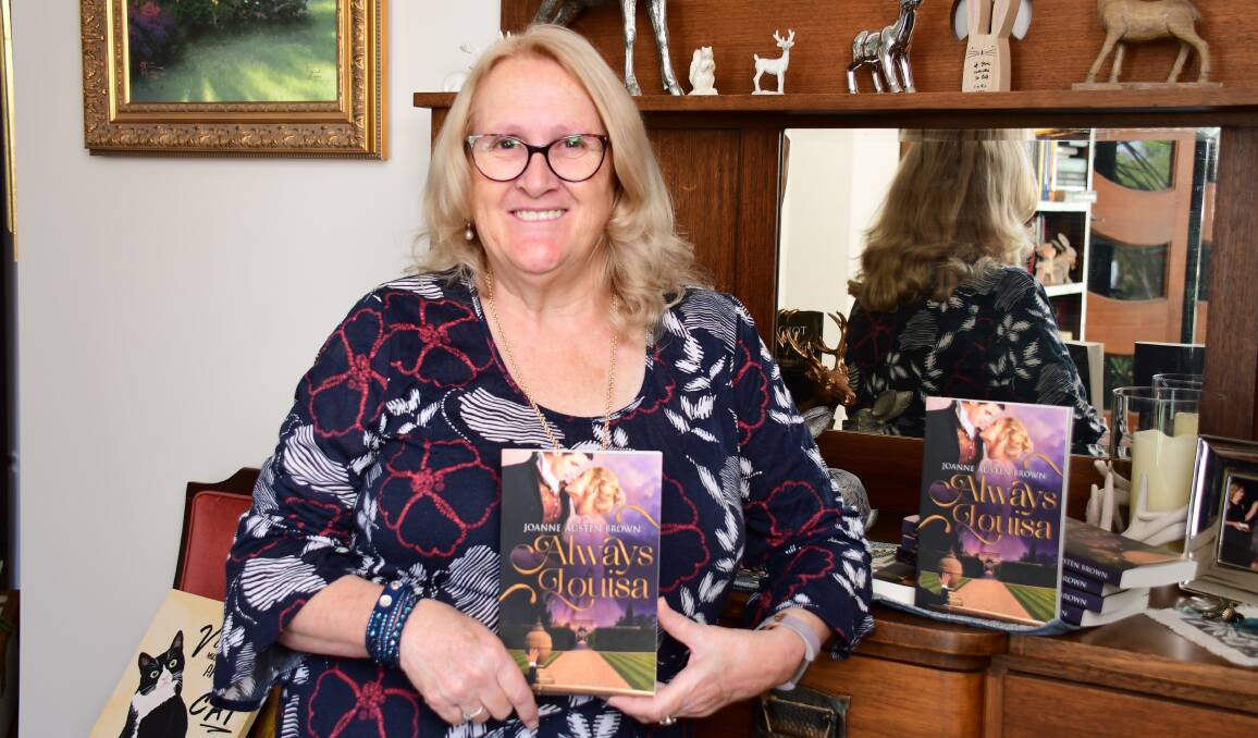 FIRST BOOK: Former law firm practice manager Joanne Boog holds Always Louisa, the first book in her Always series. Photo: BELINDA SOOLE