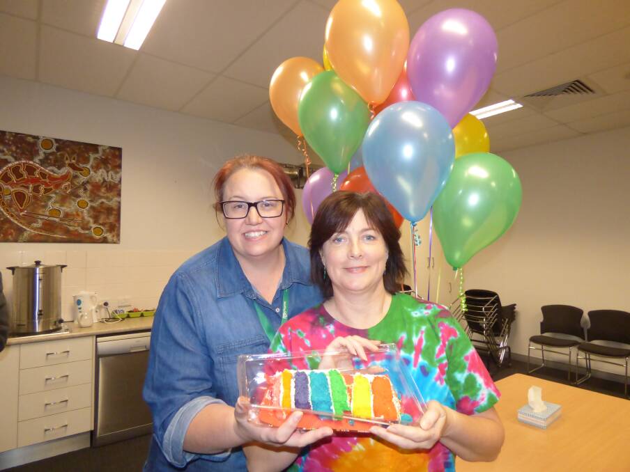 RAINBOW COLOURS: Ann-Maree Hartley and nurse unit manager of Dubbo Sexual Health Margie Crowley embrace the IDAHOBIT message of "go rainbow" at the free community afternoon tea. Photo: KIM BARTLEY