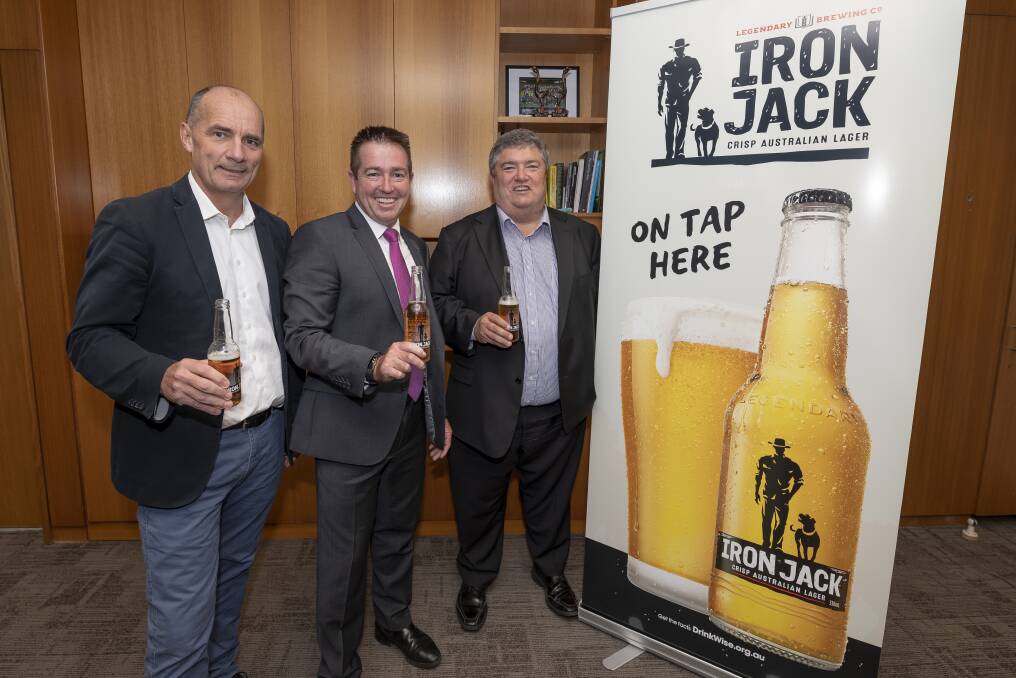 NEW CAMPAIGN: Lion Beer managing director James Brindley, Member for Bathurst Paul Toole and Rural Aid founder Charles Alder toast the start of the Beers for the Bush campaign. Photo: Contributed