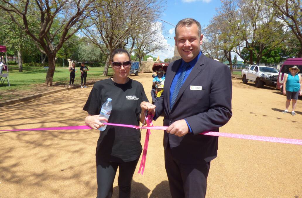 FAIR TREATMENT: Shantell Irwin and Dubbo mayor Ben Shields cut the ribbon at the start of the walk to Sydney in October. Photo: KIM BARTLEY