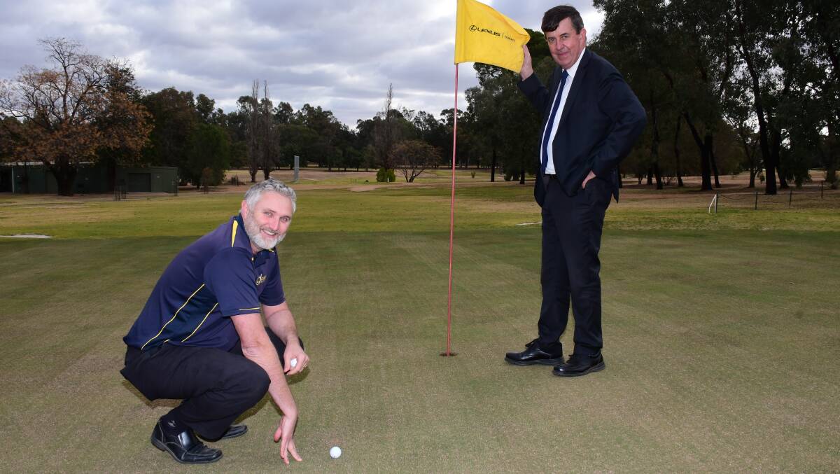 TENDER: Rod Archer, with golf club president Niall McNicol, has confirmed the letting of a tender for a new irrigation system. Photo: BELINDA SOOLE