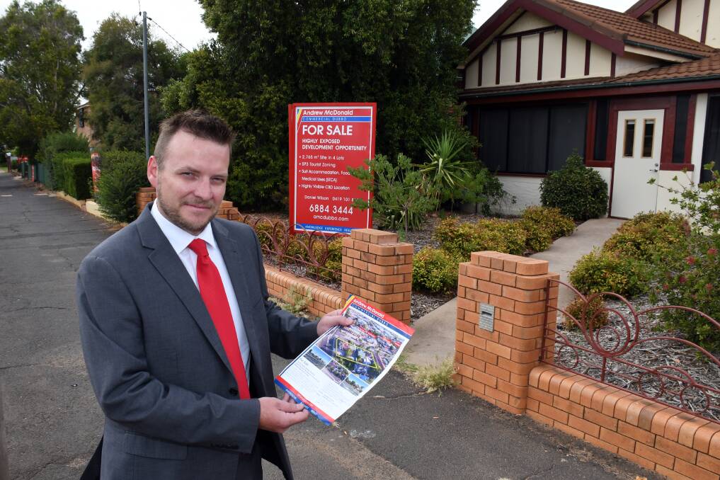 FOR SALE: Andrew McDonald Commercial Dubbo consultant Dan Wilson stands in front of one of the four properties being  marketed as a "highly-exposed development parcel" in Cobra Street. Photo: BELINDA SOOLE
