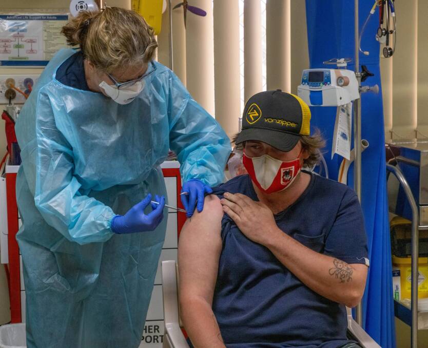 EVERY JAB COUNTS: Royal Flying Doctor Service South Eastern Section nurse Caryn Love vaccinates James Hatch at Wanaaring. PHOTO: JASON KING MEDIA. 