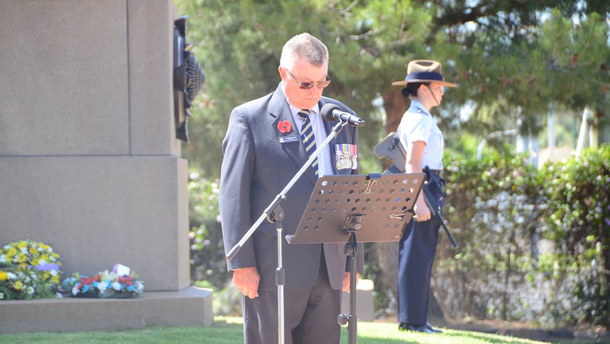 HONOURING THE FALLEN: Dubbo RSL sub-branch president Tom Gray plays his part in the 2017 Remembrance Day service at the cenotaph in Victoria Park. Photo: PAIGE WILLIAMS