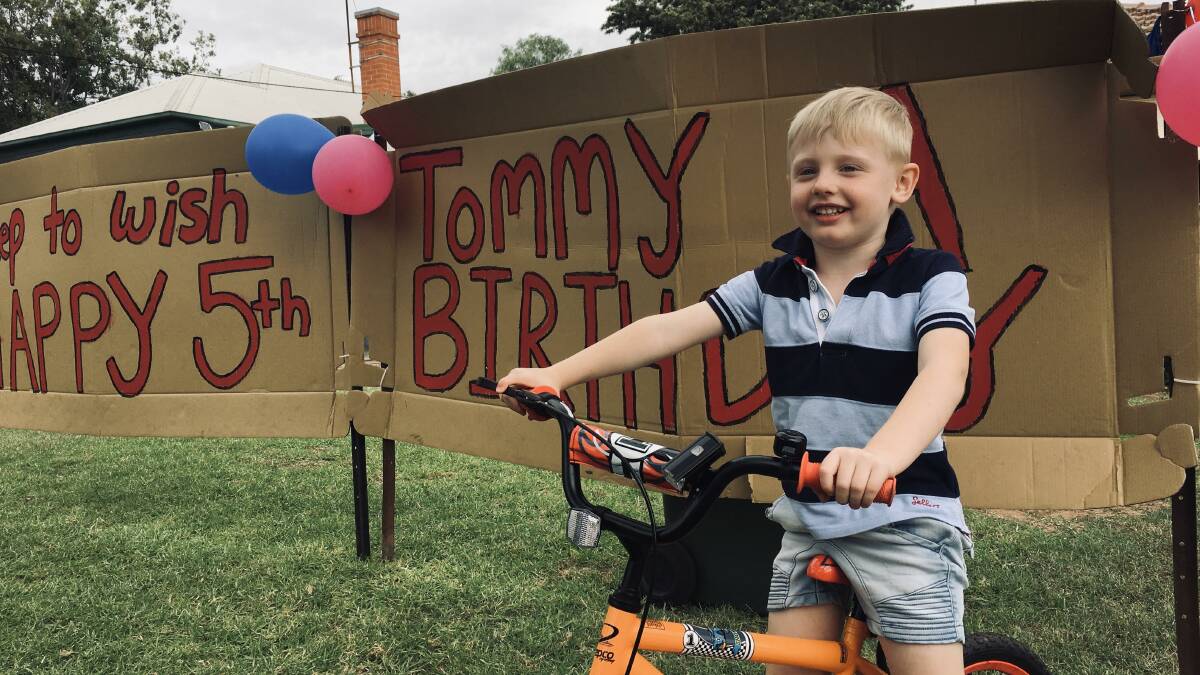BEEP BEEP: Five-year-old Thomas Nestor smiles and thanks motorists beeping their horns outside his South Dubbo home on Wednesday. Photo: CONTRIBUTED