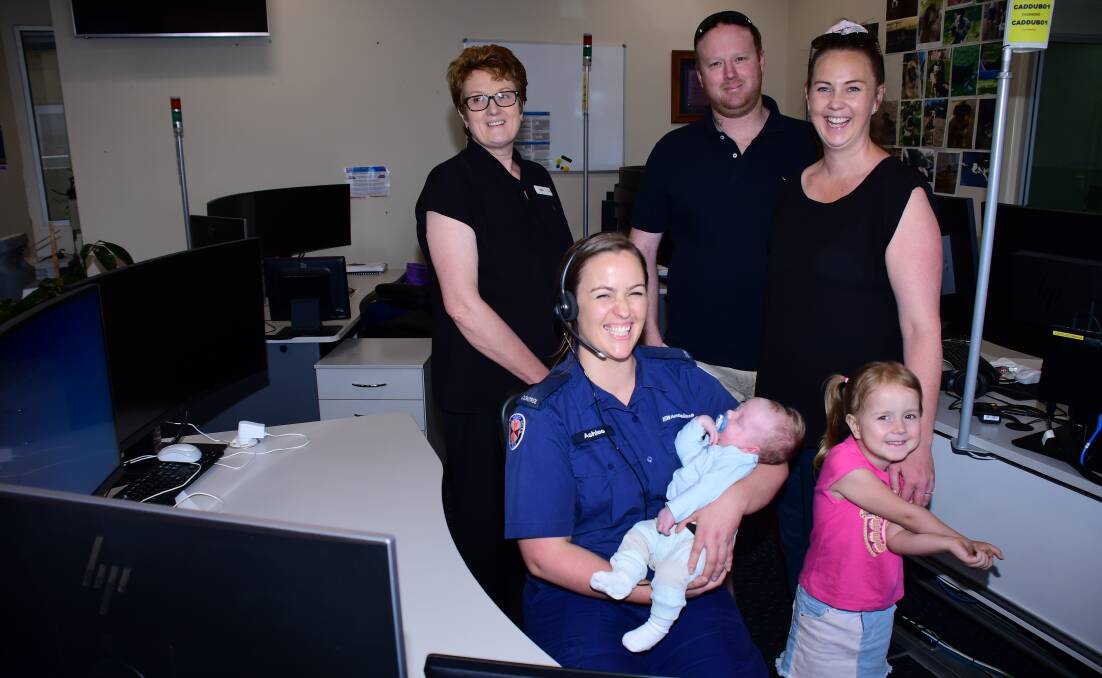 HOME BIRTH: Ashlee Bull, holding baby Max, is surrounded by Alison Bowden, Simon Bowden, Lyndal Sheil and daughter Harper. Photo: AMy MCINTYRE