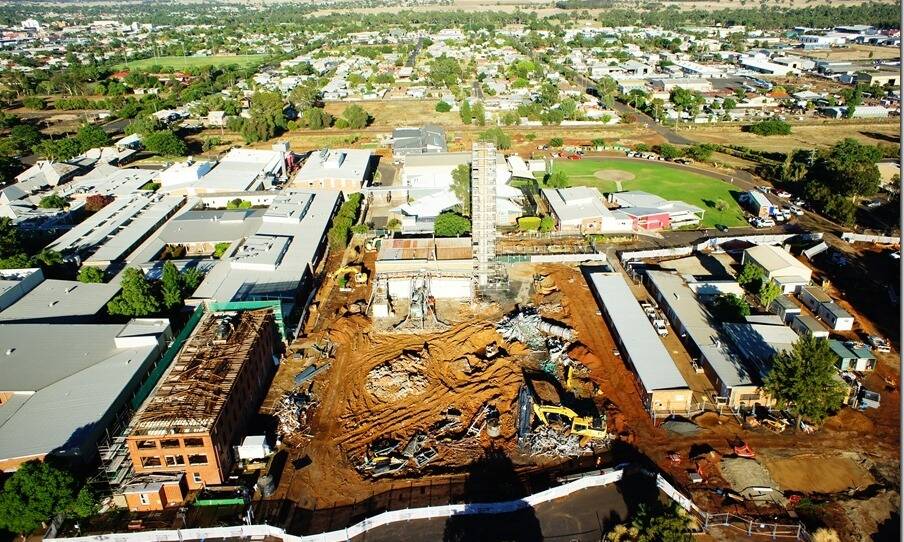 HERE WE GO AGAIN: Workmen and machinery made way for the construction of a clinical services building under stage one and two redevelopment of Dubbo Hospital. Stages three and four will begin with the construction of another floor on the clinical services building. Photo: File 