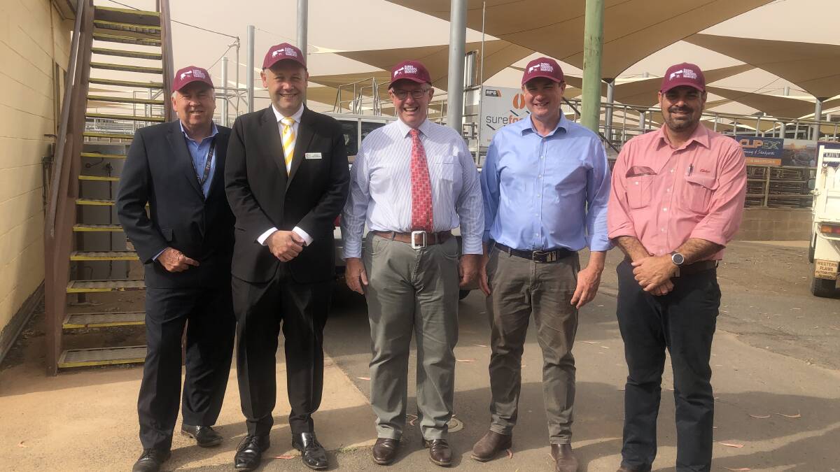 Member for Parkes Mark Coulton (centre) joins (from left) Dubbo Regional Council chief executive officer Michael McMahon, Dubbo regional mayor Ben Shields, Dubbo Regional Livestock Markets manager Ross McCarthy and Elders' Martin Simmons in inspecting the market's shade sails secured through a round one grant from the Drought Communities Program-Extension. Photo: CONTRIBUTED