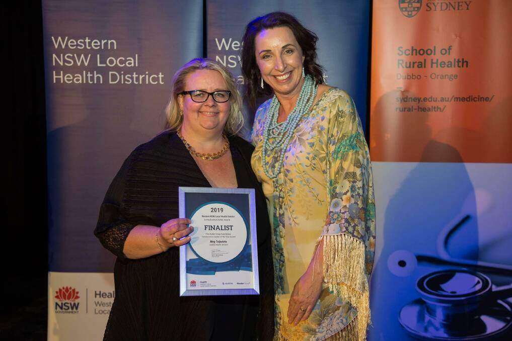 AWARD WINNER: Meg Tuipulotu is congratulated by Living Well Together manager Beth Masling. Photo: Contributed