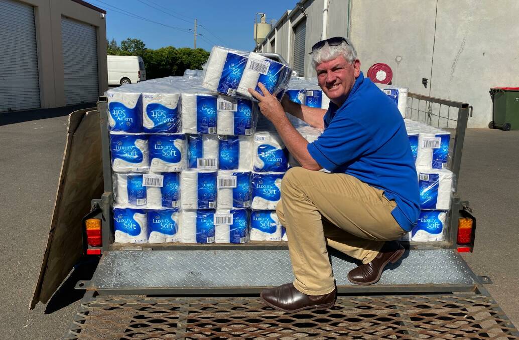 DONATION: Meals on Wheels Dubbo service manager Peter English with some of the toilet paper donated by Woolworths for distribution to elderly clients. Photo: Contributed