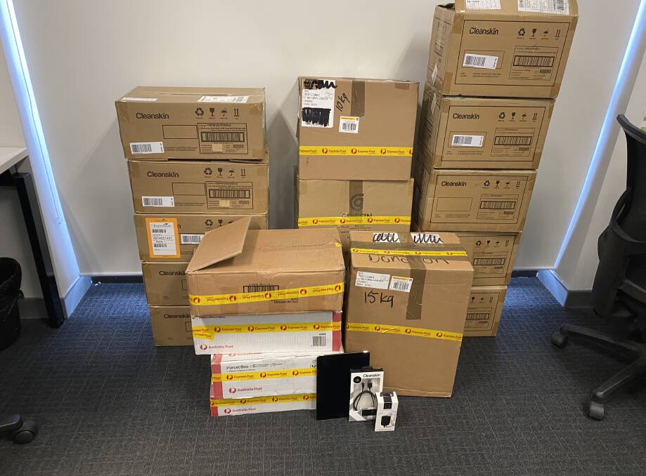 Essential Energy has provided the refurbished iPads and purchased chargers and cords now in boxes and ready for distribution. Photo: CONTRIBUTED. 