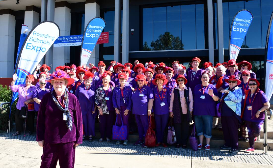 SMILE: Red Hat Society members enjoy an annual get-together organised by Pamela Ridley (front) and fellow members of the Dubbo Red Hot Flashes. PHOTO: AMY MCINTYRE