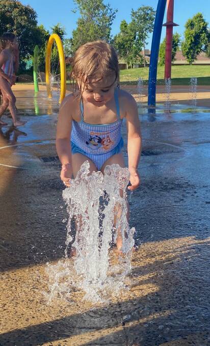 HOT SPELL: Little Lucy Irving knows exactly how to stay cool when the temperature is on the rise in Dubbo. PHOTO: BELINDA SOOLE