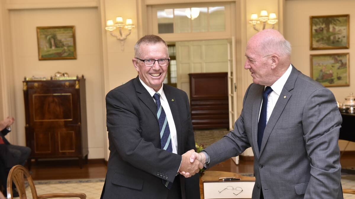 Assistant Minister for Trade, Tourism and Investment and Member for Parkes, Mark Coulton, shakes the hand of Governor-General Sir Peter Cosgrove at the swearing in ceremony at Government House in Canberra. Photo: Contributed

   