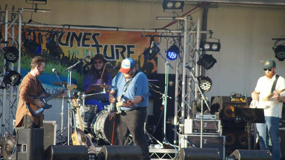 HEADLINE ACT: 2018 Toyota Star Maker of the Year Brad Cox (centre) is the headline act at Dunedoo's Tunes on the Turf on November 10. Photo: Contributed