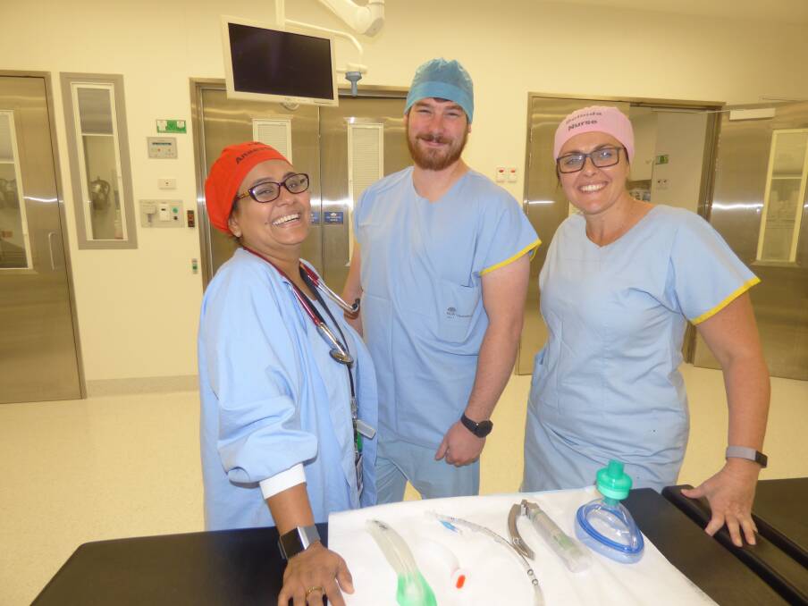 TRAINING: Dr Namrata Singh, Corey Gibson and nurse unit manager of Dubbo Hospital theatres, Belinda Shanks, chat at the end of a training session. Photo: KIM BARTLEY