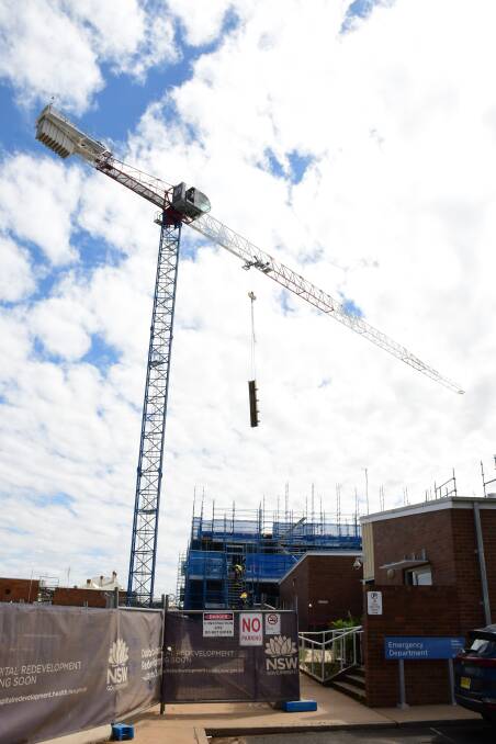 GOOD PROGRESS: A crane helps in the construction of a new three-storey building at Dubbo Hospital. Health Infrastructure reports that "good progress" is being made. Photo: BELINDA SOOLE